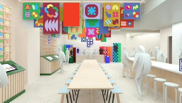 カラフルな抽象画が吊るされたモダンな屋内空間