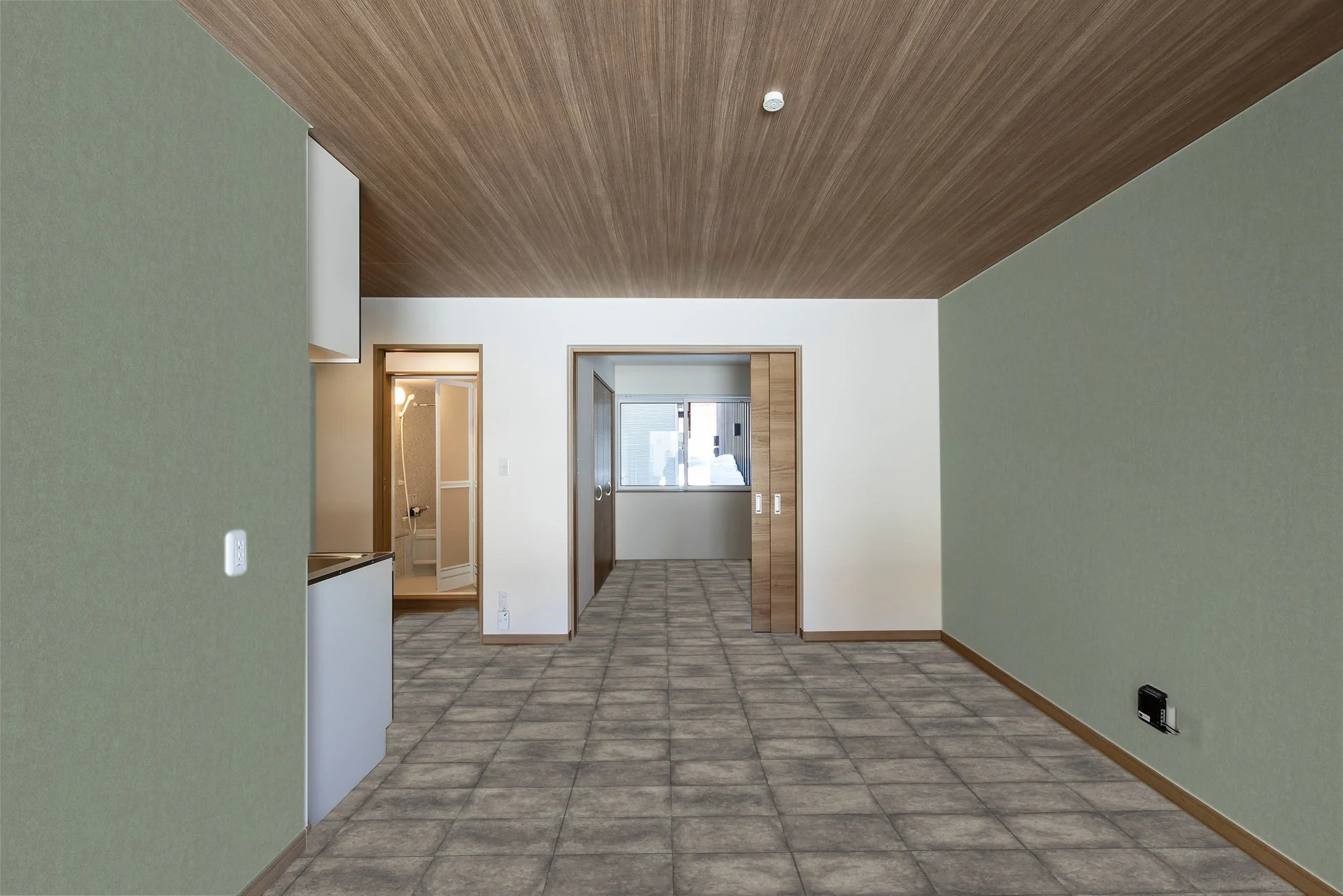 木目調の天井とタイル床のワンルーム