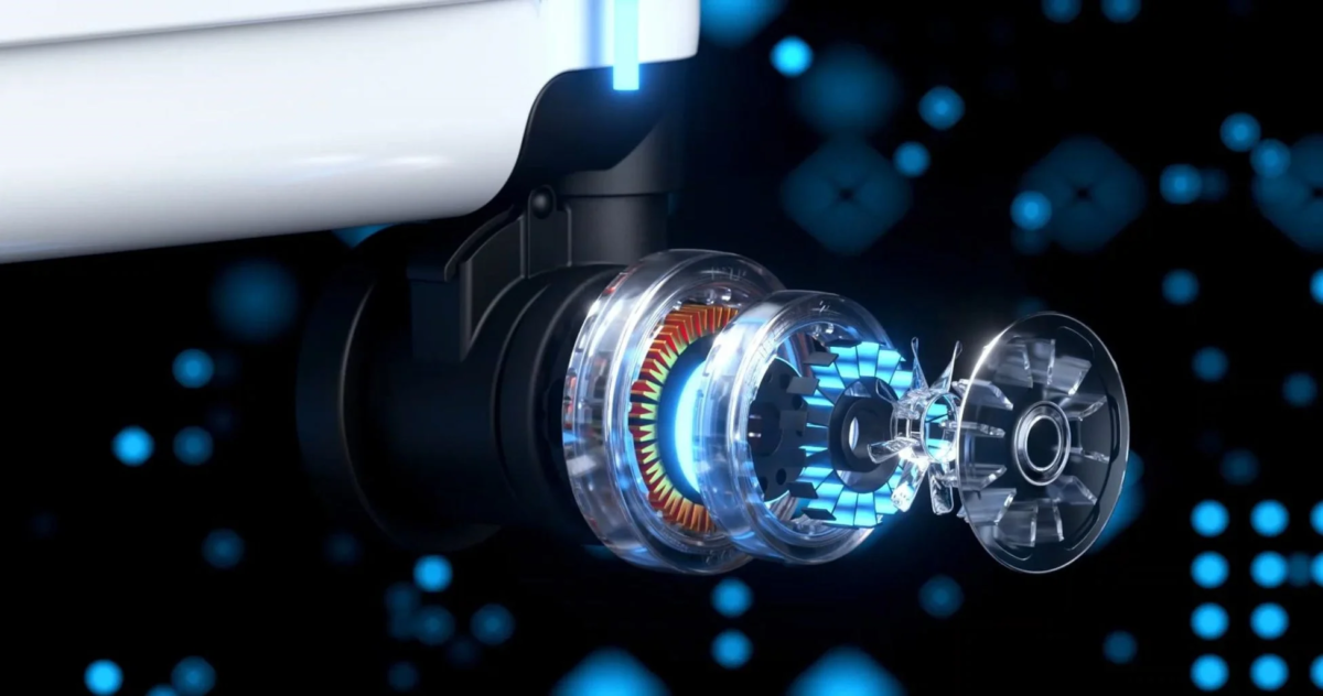 青く光る透明なギアやコイルが見える機械の内部構造を示した3Dレンダリング画像です。複雑なメカニズムが未来的な雰囲気で表現されています。