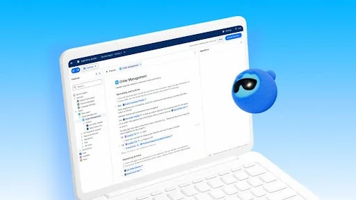 ノートパソコンと青いキャラクターが描かれており、ビジネスアプリケーションのUIが見える